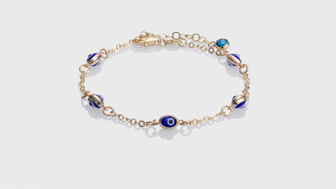 10K Yellow Gold Kids Adjustable Bracelet With 5 Oval Royal Blue Eye Charms